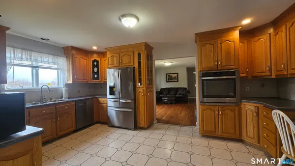 a kitchen with sink cabinets and window