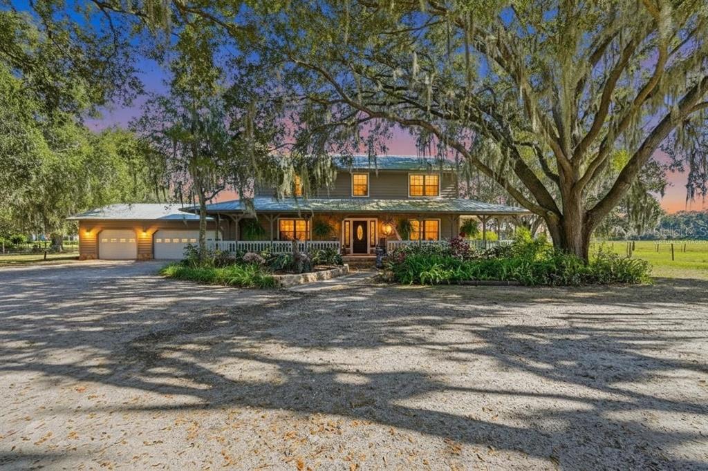 2911 Walker Road Lakeland, FL 33810 - Photo 1 of 70 a front view of a building with trees