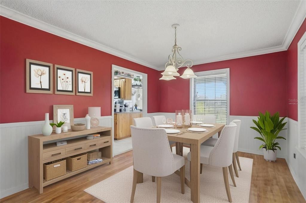 2911 Walker Road Lakeland, FL 33810 - Photo 21 of 70 a view of a dining room with furniture window and wooden floor