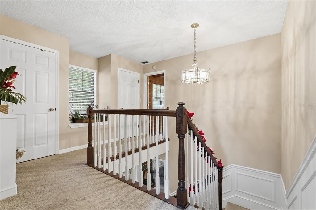 2911 Walker Road Lakeland, FL 33810 - Photo 25 of 70 a view of a hallway with windows and stairs
