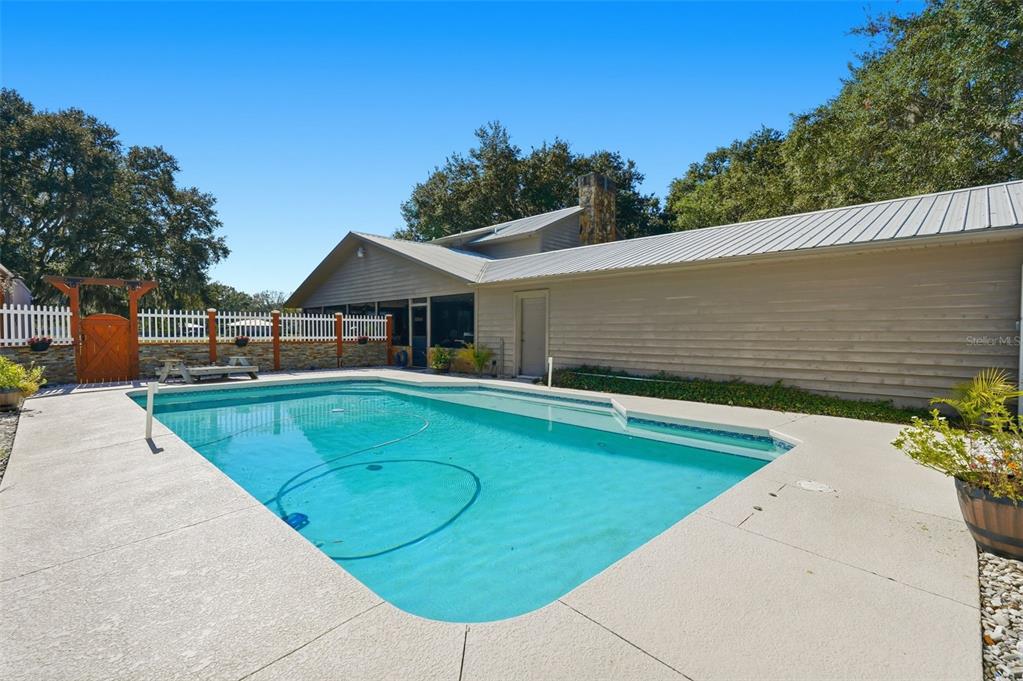 2911 Walker Road Lakeland, FL 33810 - Photo 3 of 70 a view of a swimming pool with a patio