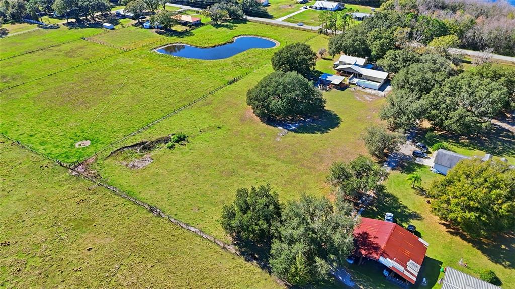 2911 Walker Road Lakeland, FL 33810 - Photo 45 of 70 a view of swimming pool a garden and lake view
