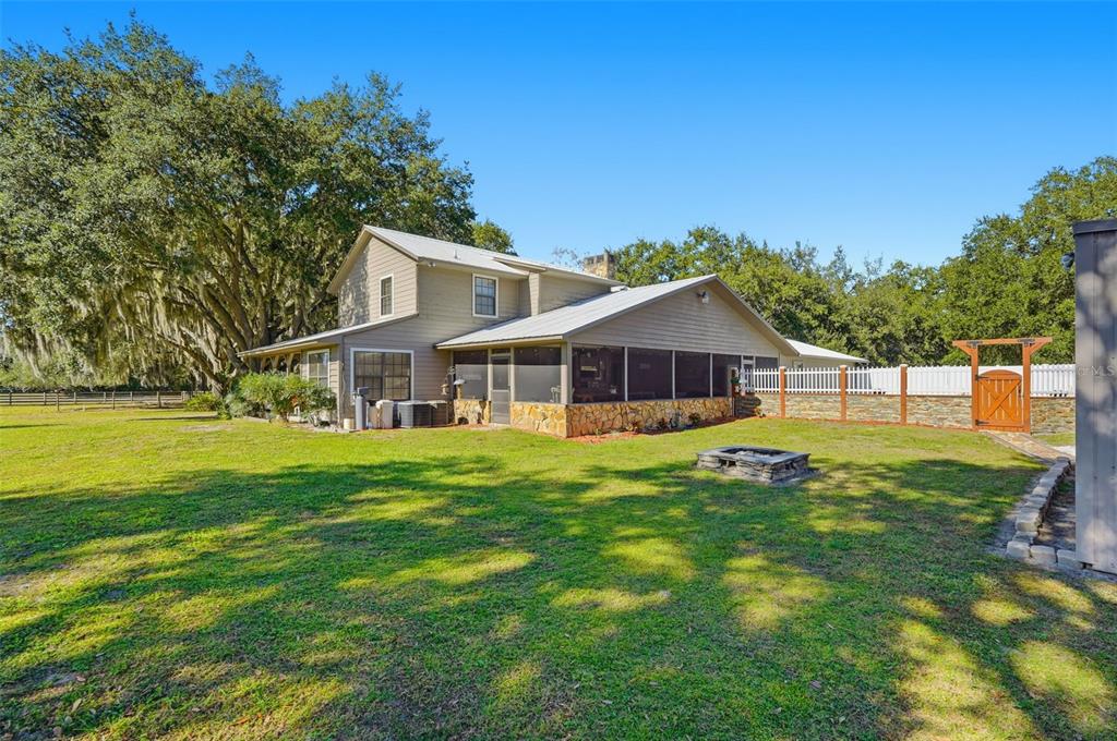 2911 Walker Road Lakeland, FL 33810 - Photo 52 of 70 a front view of a house with yard and green space
