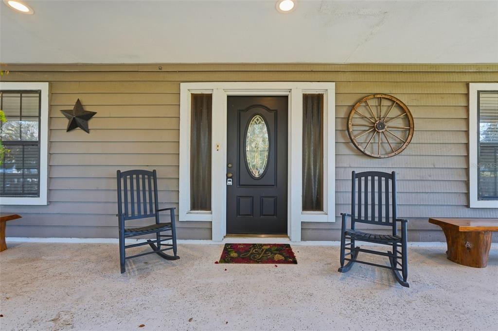 2911 Walker Road Lakeland, FL 33810 - Photo 56 of 70 a living room with furniture a clock and a window