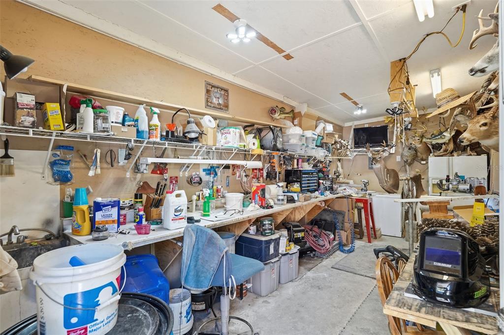 2911 Walker Road Lakeland, FL 33810 - Photo 63 of 70 a room with lots of furniture and clutter