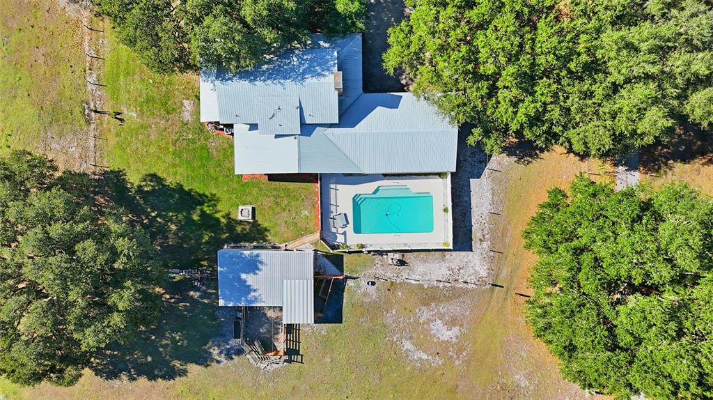 2911 Walker Road Lakeland, FL 33810 - Photo 68 of 70 an aerial view of a house with swimming pool and large trees