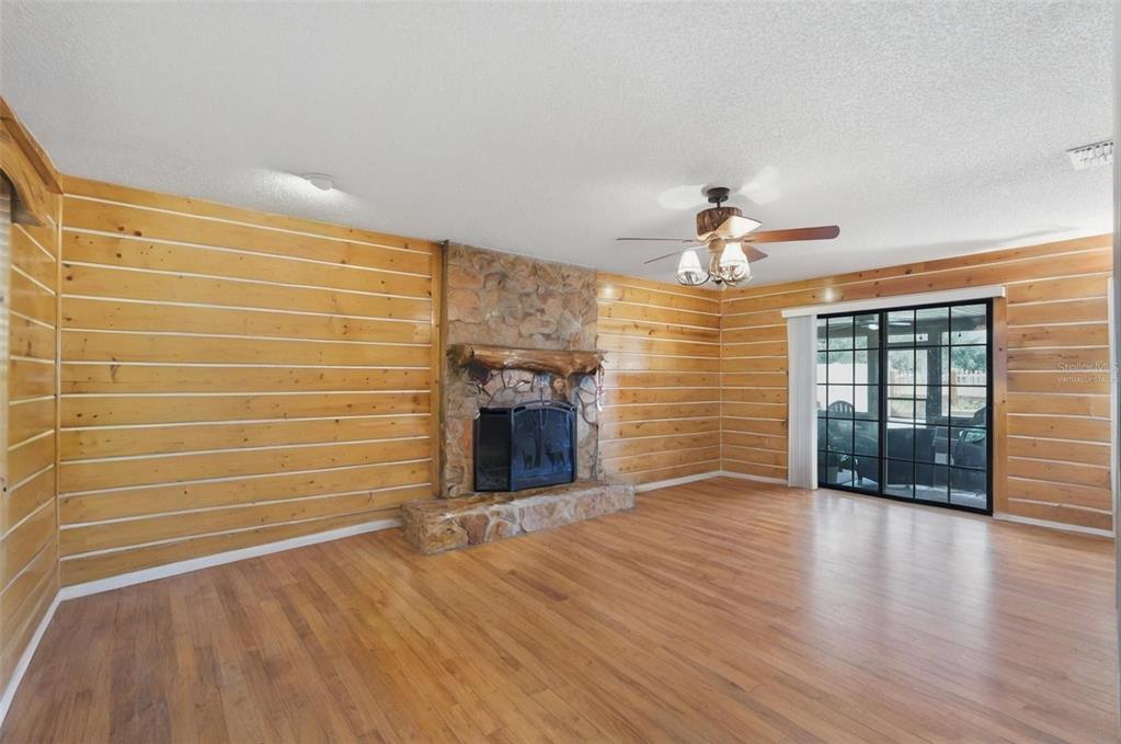 2911 Walker Road Lakeland, FL 33810 - Photo 7 of 70 a view of livingroom with hardwood floor and a ceiling fan