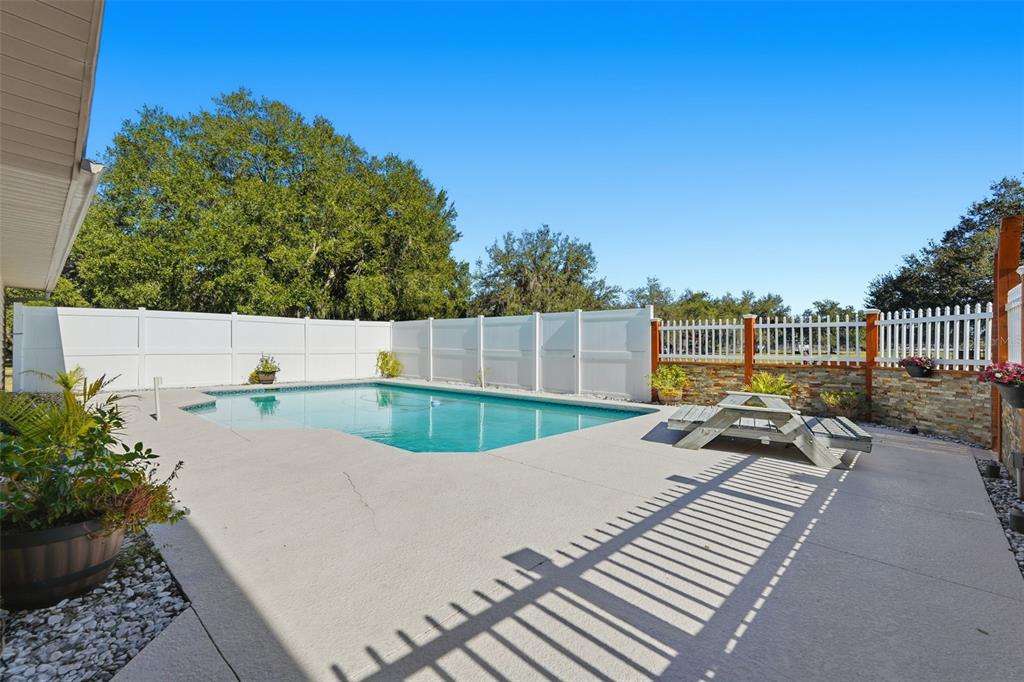 2911 Walker Road Lakeland, FL 33810 - Photo 10 of 70 a view of a swimming pool with a patio