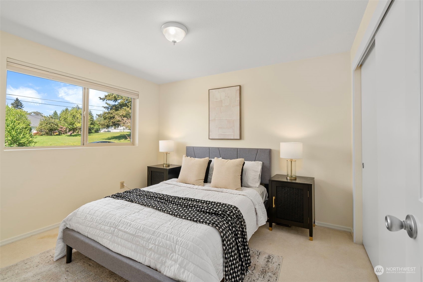 1201 North 28th Place Renton, WA 98056 - Photo 11 of 25 a bedroom with a bed and a window