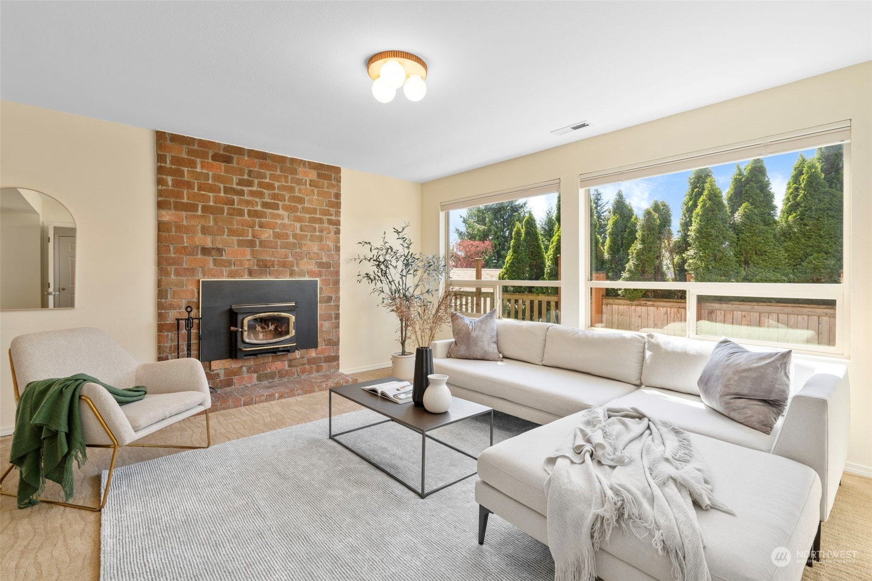 1201 North 28th Place Renton, WA 98056 - Photo 15 of 25 a living room with furniture and a fireplace