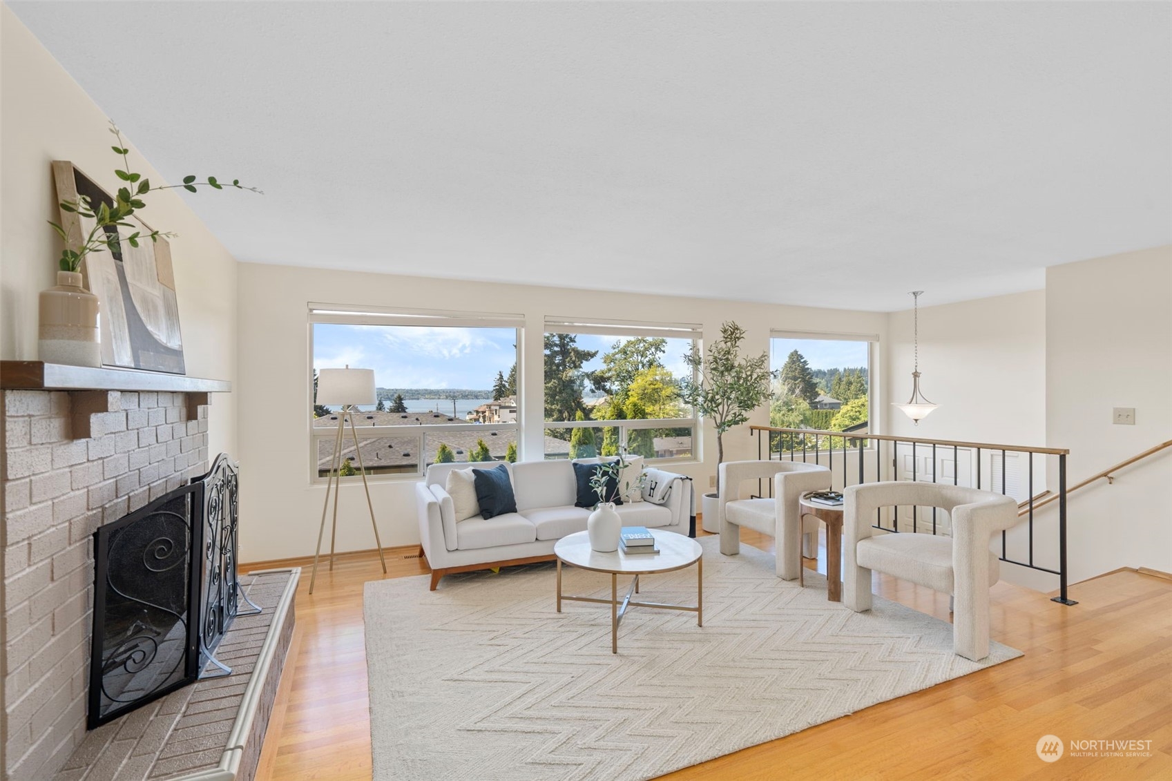 1201 North 28th Place Renton, WA 98056 - Photo 3 of 25 a living room with furniture a fireplace and a table