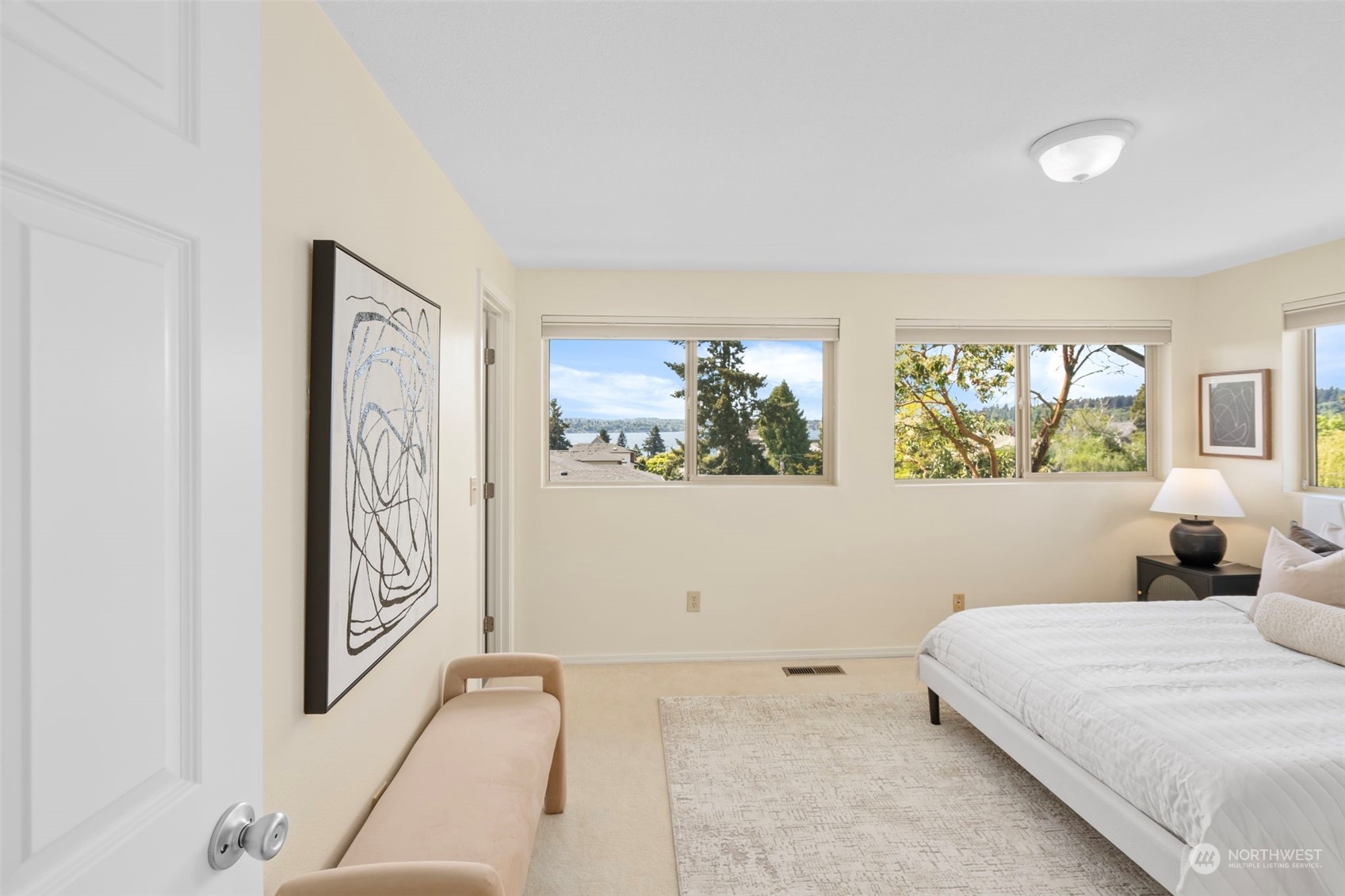 1201 North 28th Place Renton, WA 98056 - Photo 7 of 25 a bedroom with a bed and a painting on the wall