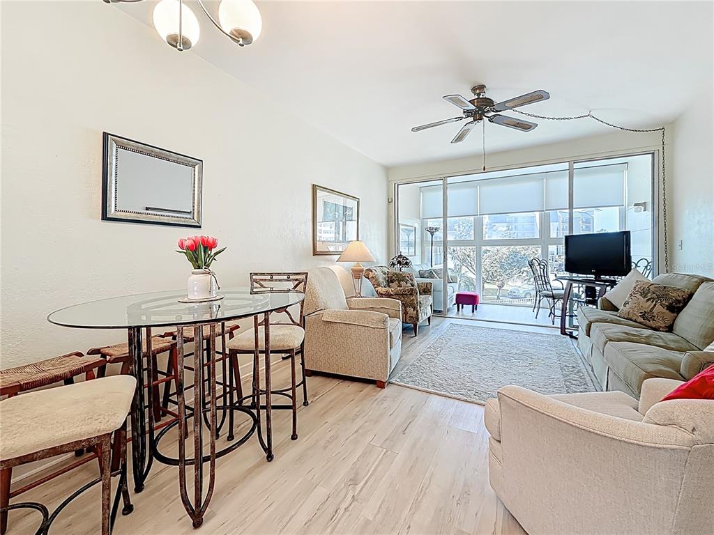 7050 Sunset Way, Unit 22 St. Pete Beach, FL 33706 - Photo 13 of 30 a living room with furniture and white walls
