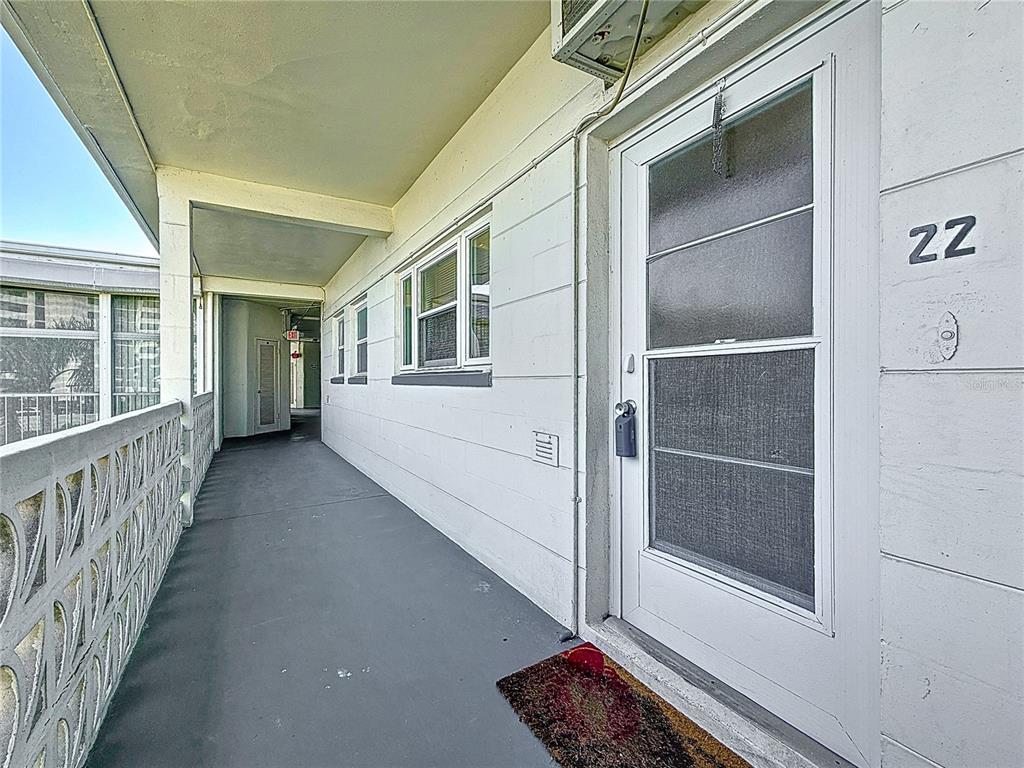 7050 Sunset Way, Unit 22 St. Pete Beach, FL 33706 - Photo 6 of 30 a view of an entryway with a window