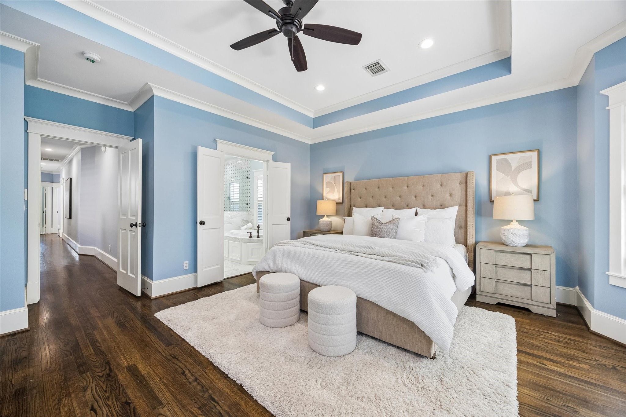 634 West 17th Street Houston, TX 77008 - Photo 18 of 42 This peaceful primary bedroom offers plenty of room to unwind, with elegant millwork, warm wood flooring, soft natural light, and direct access to the spa-like ensuite bath and custom walk-in closet.