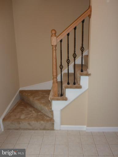 280 North Cottage Road Sterling, VA 20164 - Photo 7 of 16 Entry with ceramic tile. note iron railing