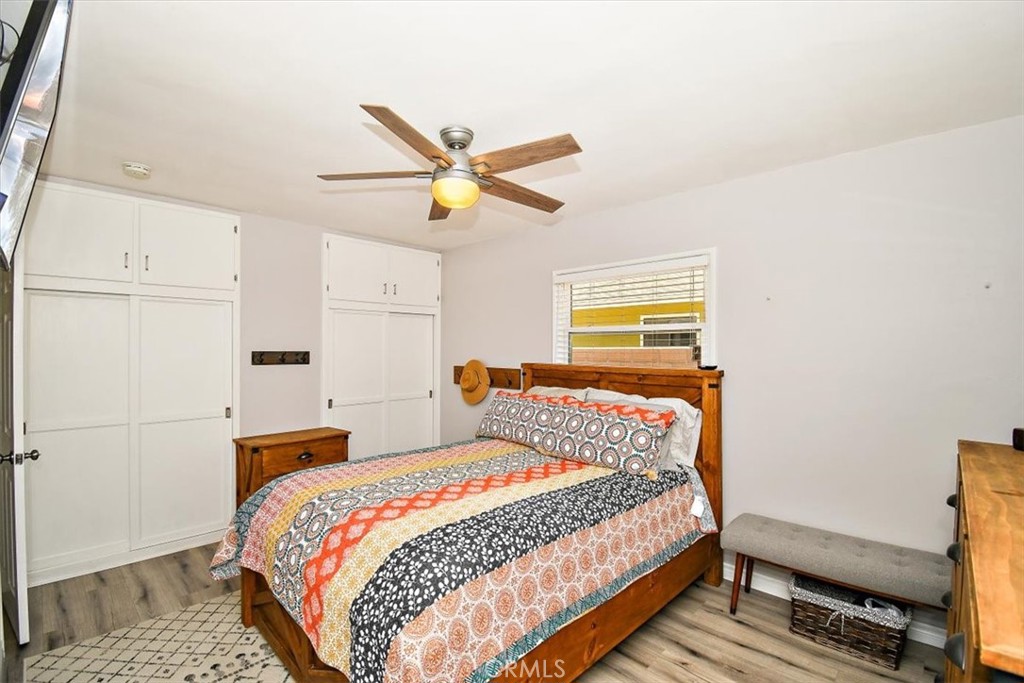 3315 Spring Garden Street Riverside, CA 92501 - Photo 16 of 38 a bedroom with a bed and a chandelier