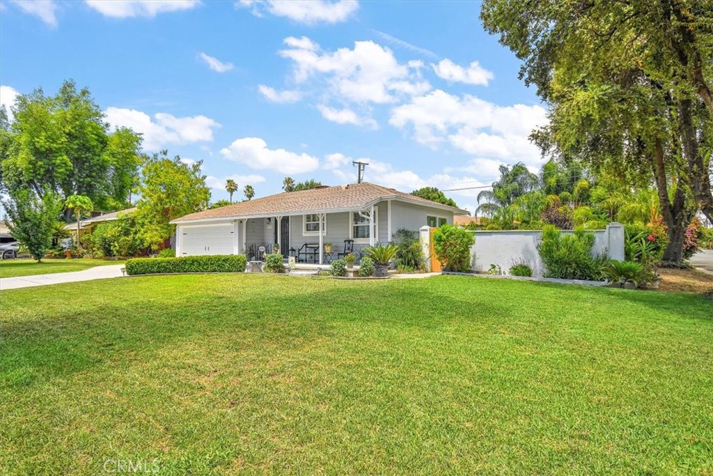 3315 Spring Garden Street Riverside, CA 92501 - Photo 2 of 38 a front view of a house with garden