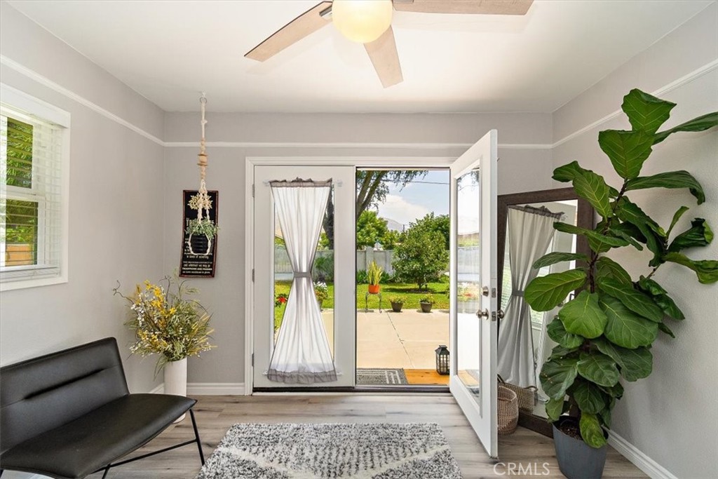 3315 Spring Garden Street Riverside, CA 92501 - Photo 21 of 38 a view of a hallway with wooden floor and a potted plant