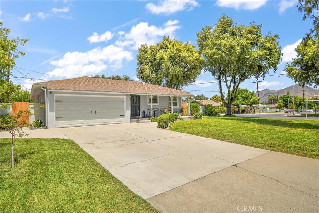 3315 Spring Garden Street Riverside, CA 92501 - Photo 33 of 38 a front view of house with yard and green space