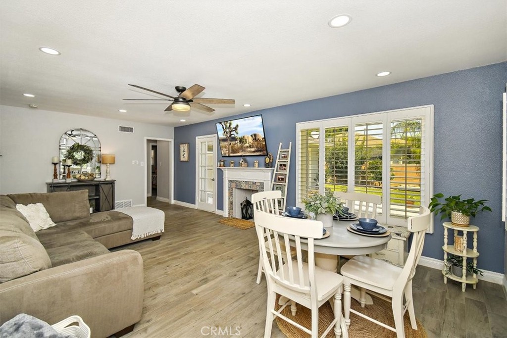 3315 Spring Garden Street Riverside, CA 92501 - Photo 6 of 38 a view of a dining room with furniture and wooden floor