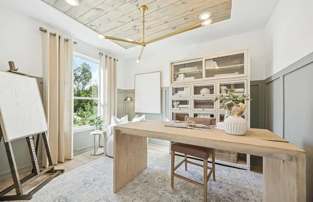a dining room with a table chairs and wooden floor