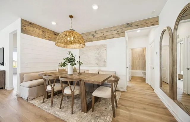 a dining room with furniture and window