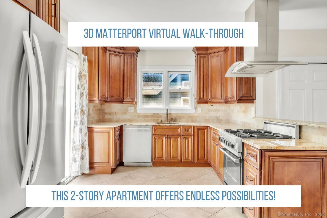 a kitchen with stainless steel appliances granite countertop a refrigerator a stove and a sink