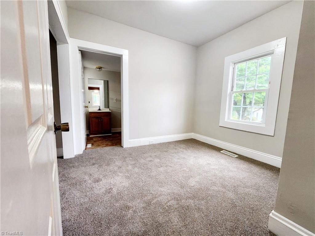 5207 Old Rural Hall Road Winston-Salem, NC 27105 - Photo 5 of 14 Primary bedroom with en suite
