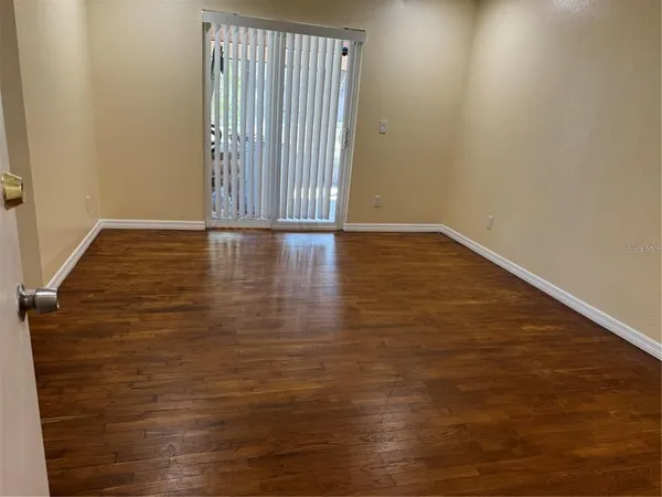 a view of a livingroom with wooden floor