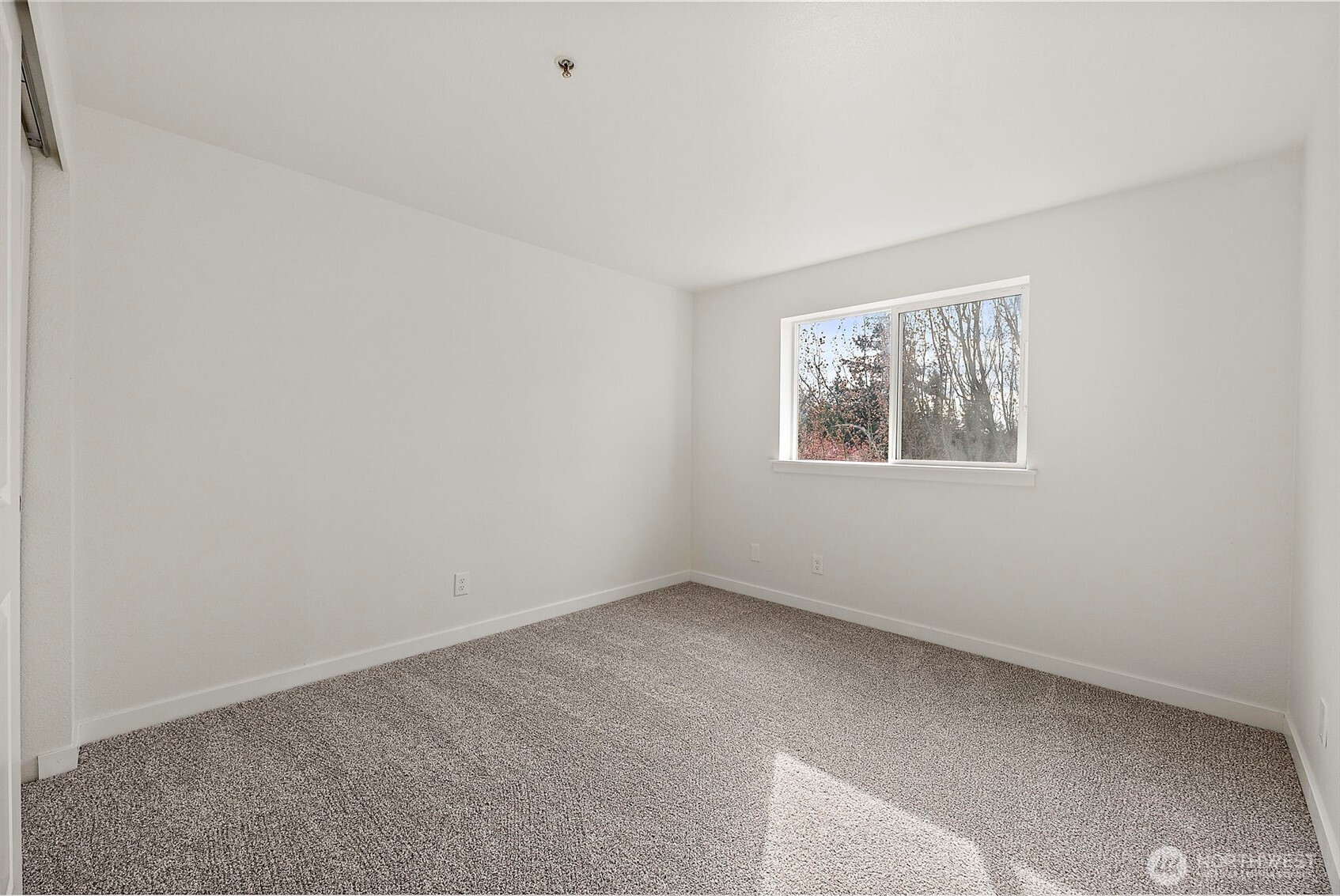 3939 10th Street Southeast, Unit G4 Puyallup, WA 98374 - Photo 16 of 25 an empty room with windows