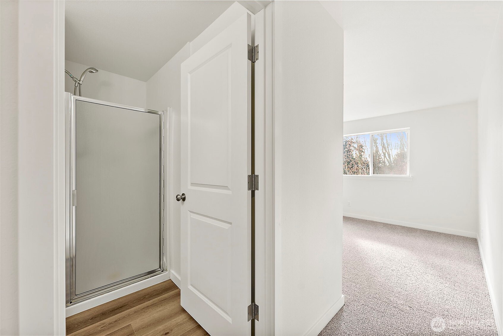 3939 10th Street Southeast, Unit G4 Puyallup, WA 98374 - Photo 17 of 25 a view of a hallway with wooden floor and closet