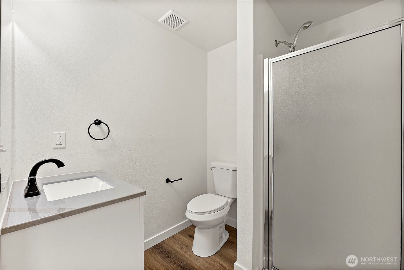 3939 10th Street Southeast, Unit G4 Puyallup, WA 98374 - Photo 18 of 25 a bathroom with a toilet and a sink