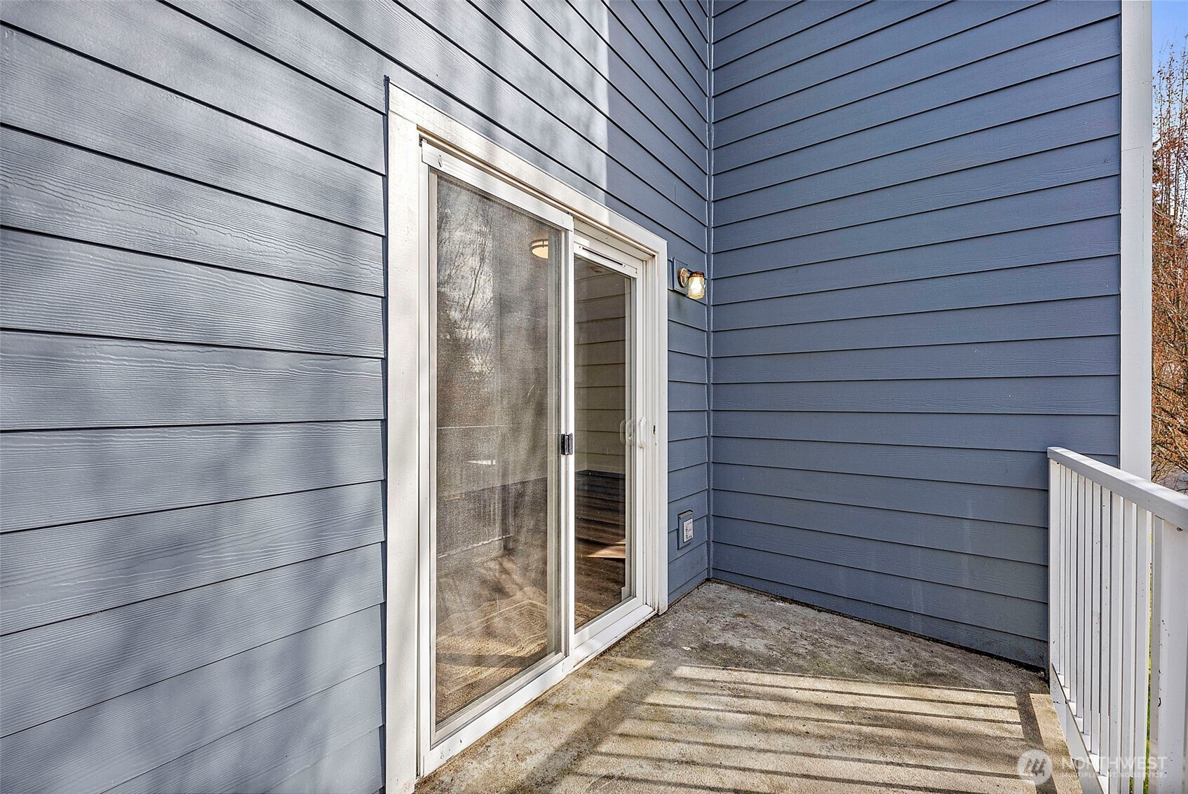 3939 10th Street Southeast, Unit G4 Puyallup, WA 98374 - Photo 20 of 25 a view of a house with a brick wall and floor to ceiling window