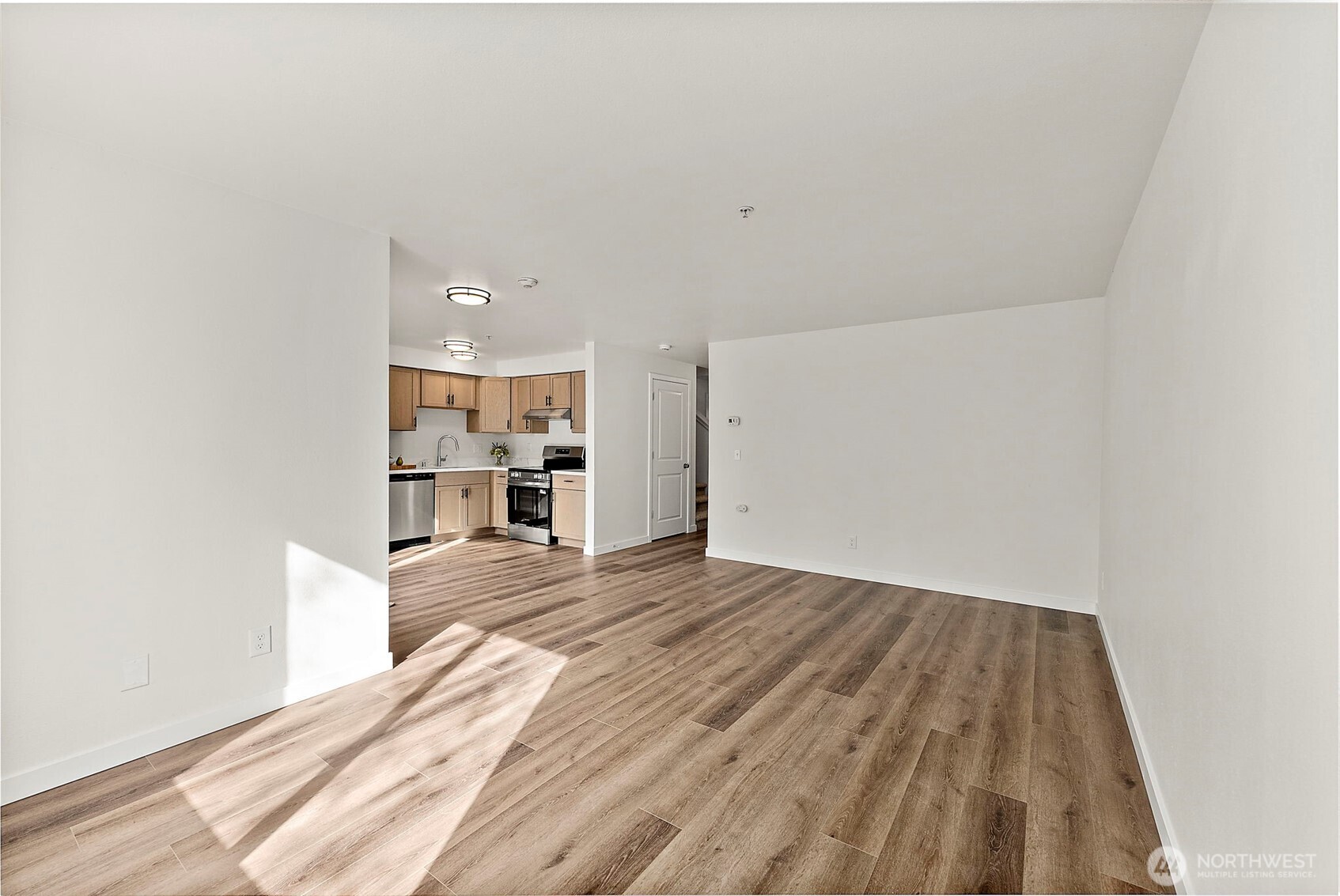 3939 10th Street Southeast, Unit G4 Puyallup, WA 98374 - Photo 10 of 25 a view of a room with wooden floor and a window