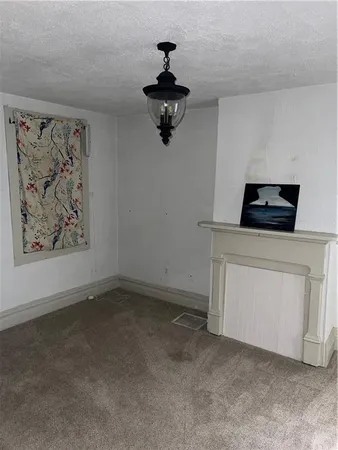 a kitchen with a stove and a cabinet