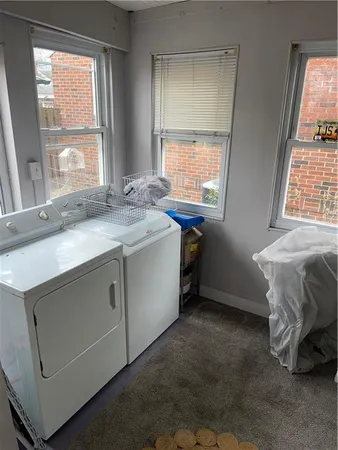 a view of room with a ceiling fan and window