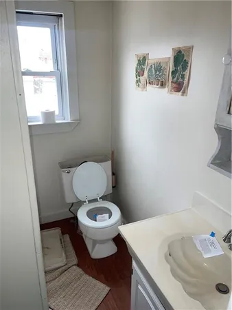 a view of a room with gym equipment and a window