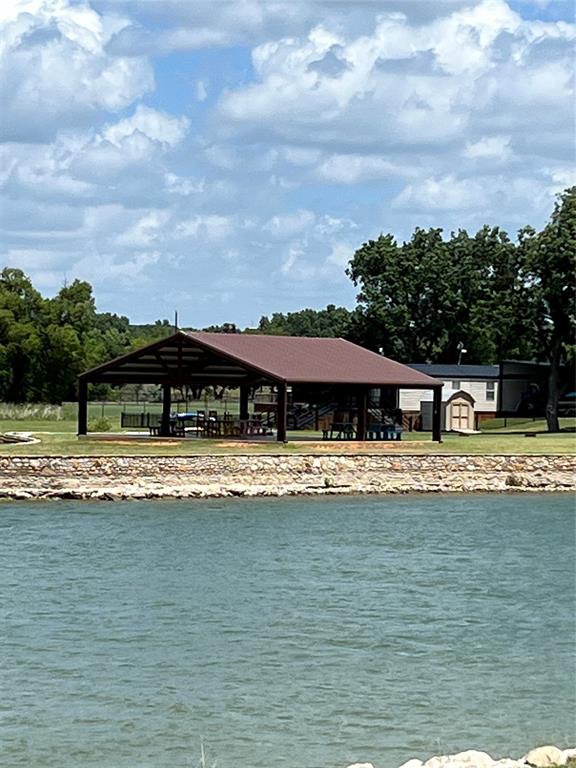 2334 San Bar Road, Unit 46 Graford, TX 76449 - Photo 35 of 37 a view of pool with umbrella and trees