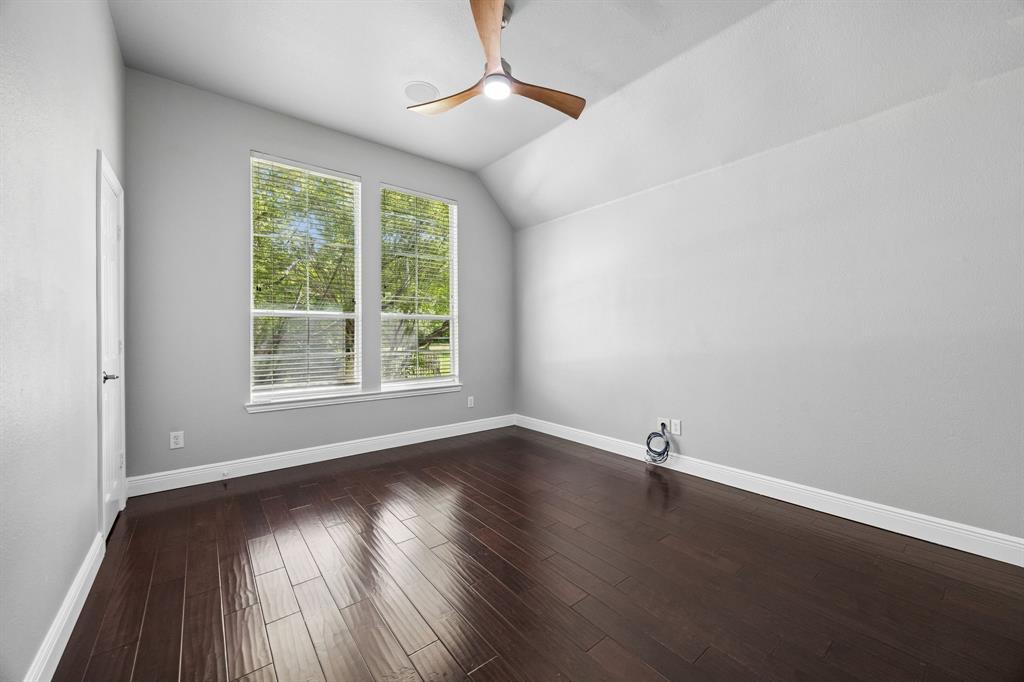 5808 Rathbone Drive Parker, TX 75002 - Photo 17 of 39 First floor secondary bedroom with adjacent full bathroom is near the family room. This is a perfect space for guests, multigenerational living - the potential is limitless.
