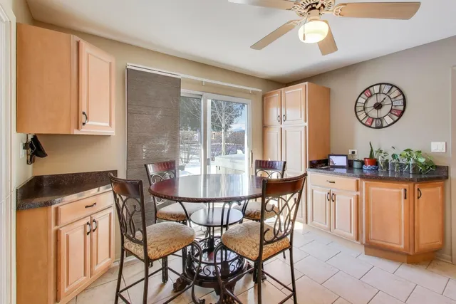 a dining room with furniture and window