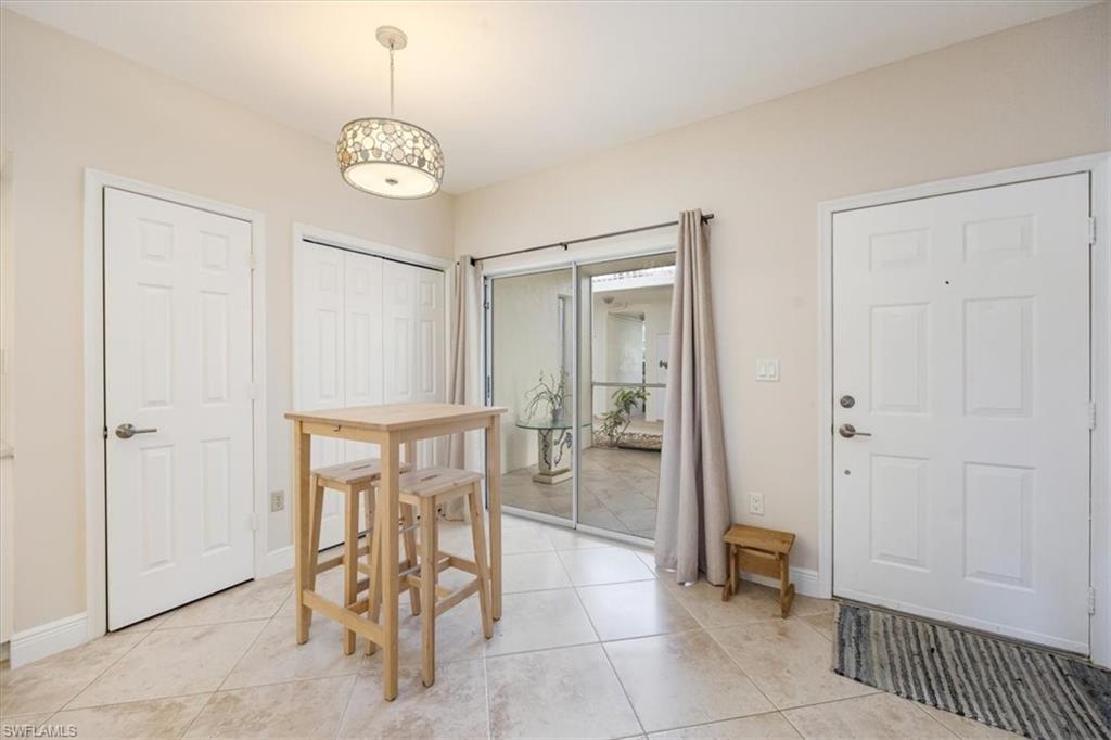 6025 Chardonnay Lane, Unit 103 Naples, FL 34119 - Photo 20 of 45 a view of an empty room and dining room