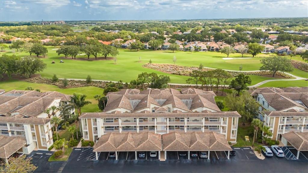 6025 Chardonnay Lane, Unit 103 Naples, FL 34119 - Photo 2 of 45 an aerial view of a house with a ocean view