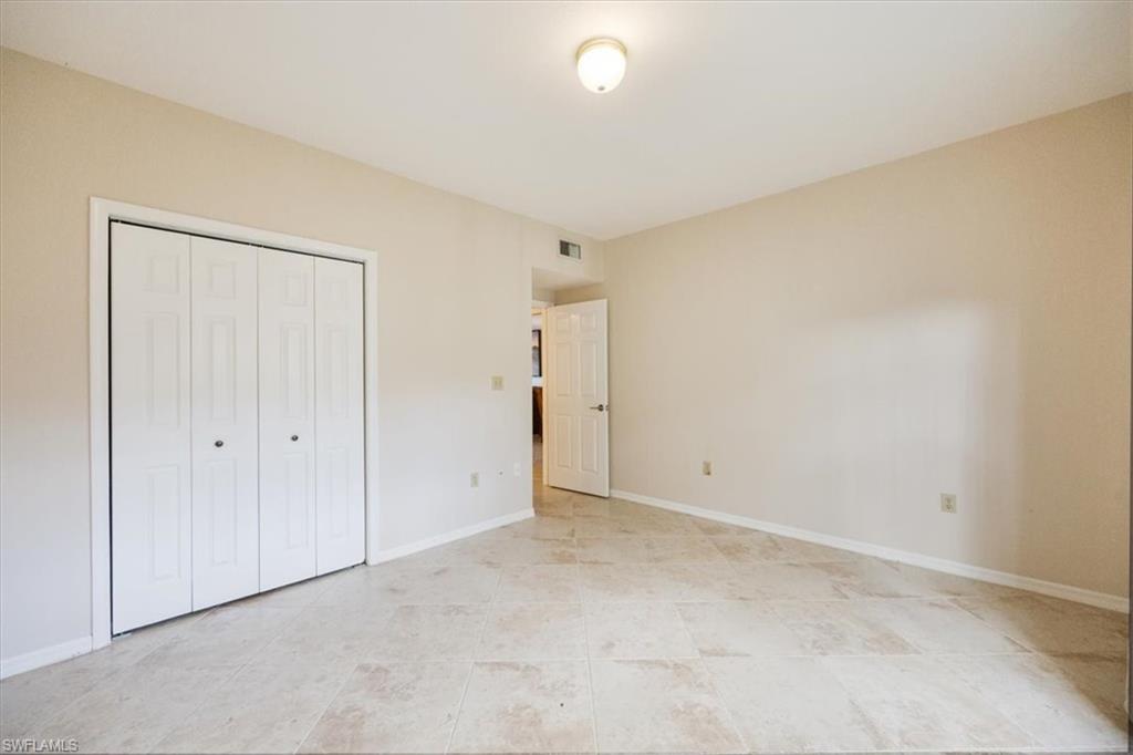 6025 Chardonnay Lane, Unit 103 Naples, FL 34119 - Photo 30 of 45 a view of an empty room