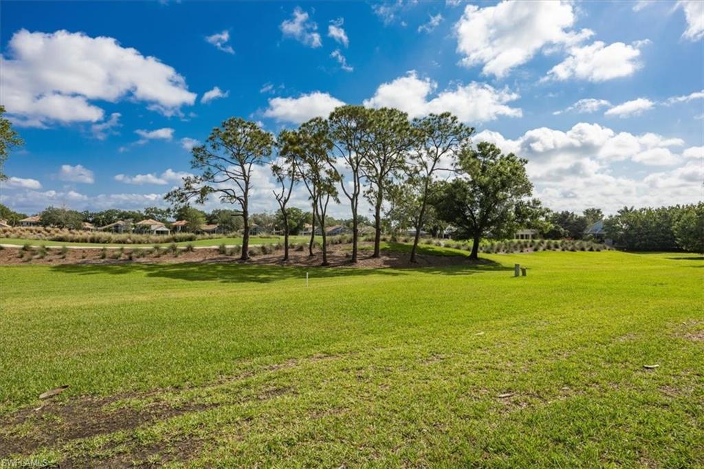 6025 Chardonnay Lane, Unit 103 Naples, FL 34119 - Photo 38 of 45 a view of building with ocean view