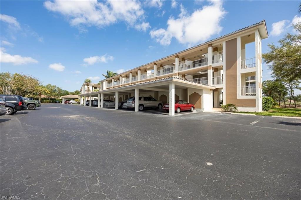 6025 Chardonnay Lane, Unit 103 Naples, FL 34119 - Photo 5 of 45 a view of a building with a street