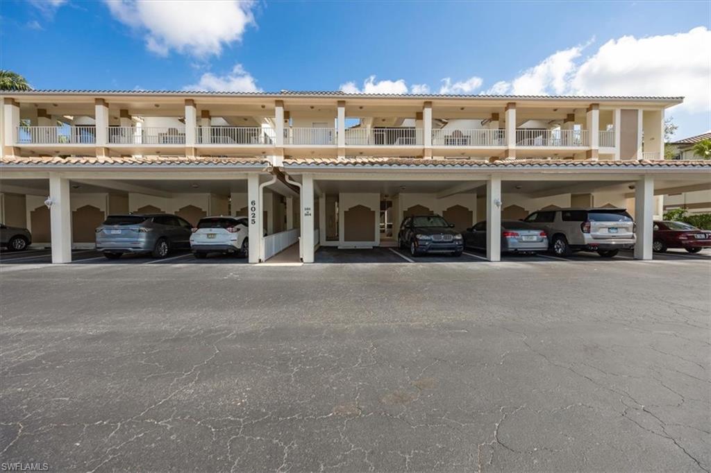 6025 Chardonnay Lane, Unit 103 Naples, FL 34119 - Photo 6 of 45 a view of building with car parked