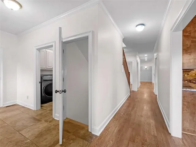 a view of a kitchen and dining room with wooden floor a fireplace
