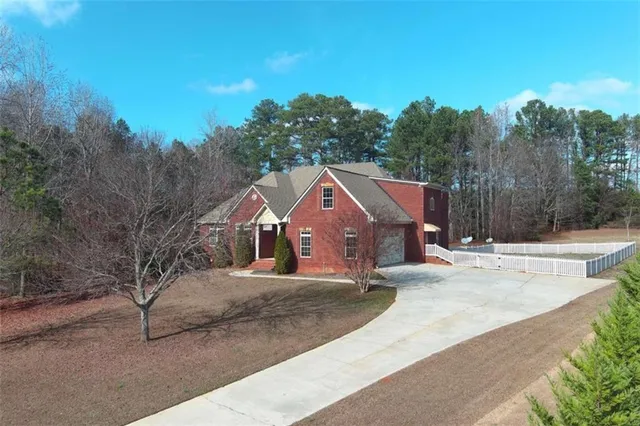 an aerial view of a house with a floor to ceiling window