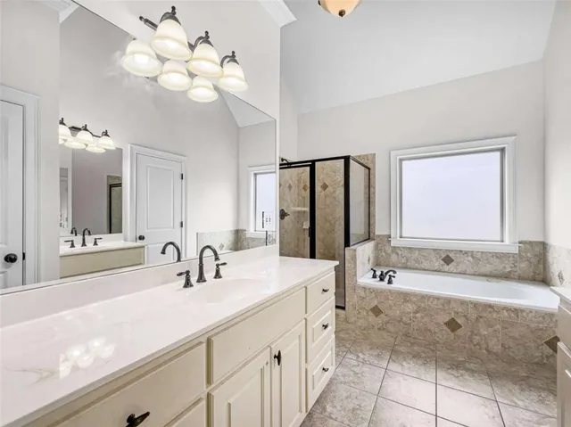 a view of a house with backyard and wooden deck